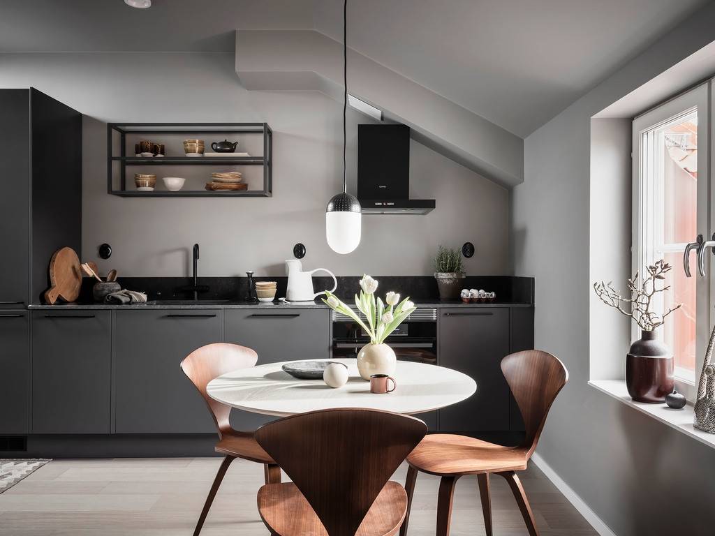 A Small Gray Attic Apartment in Sweden 5 gray-kitchen-cabinets-round-dining-table-nordic-design-nordroom