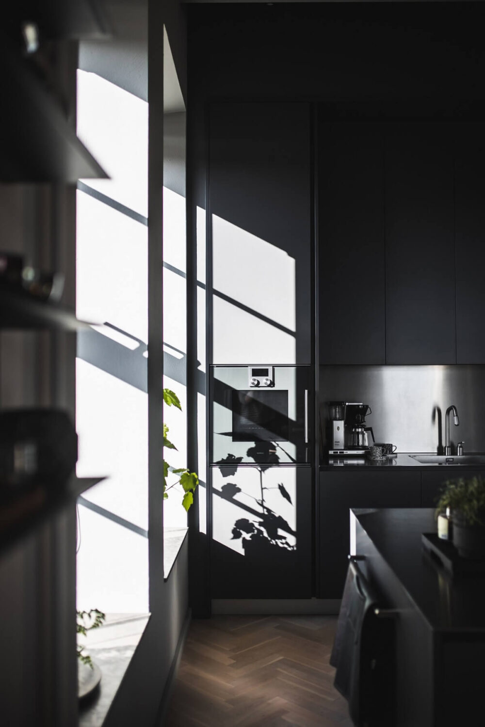 A Modern Gray Industrial Apartment 7 gray-kitchen-natural-light-industrial-apartment-nordroom