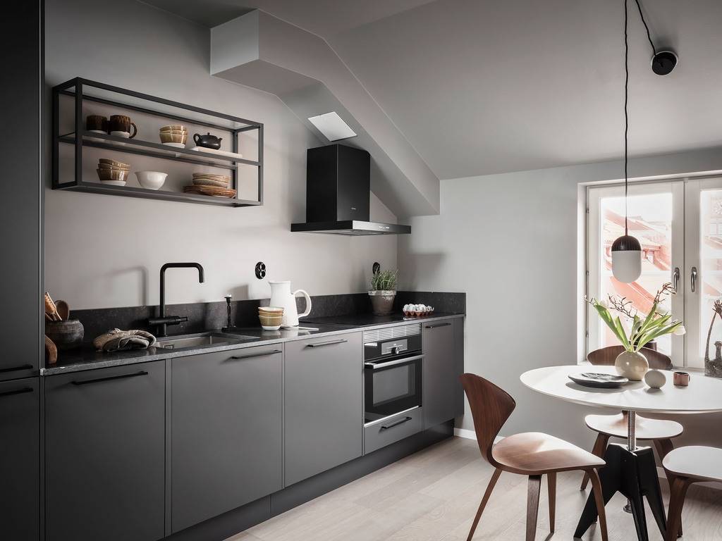 A Small Gray Attic Apartment in Sweden 6 gray-nordic-design-kitchen-slanted-ceiling-nordroom