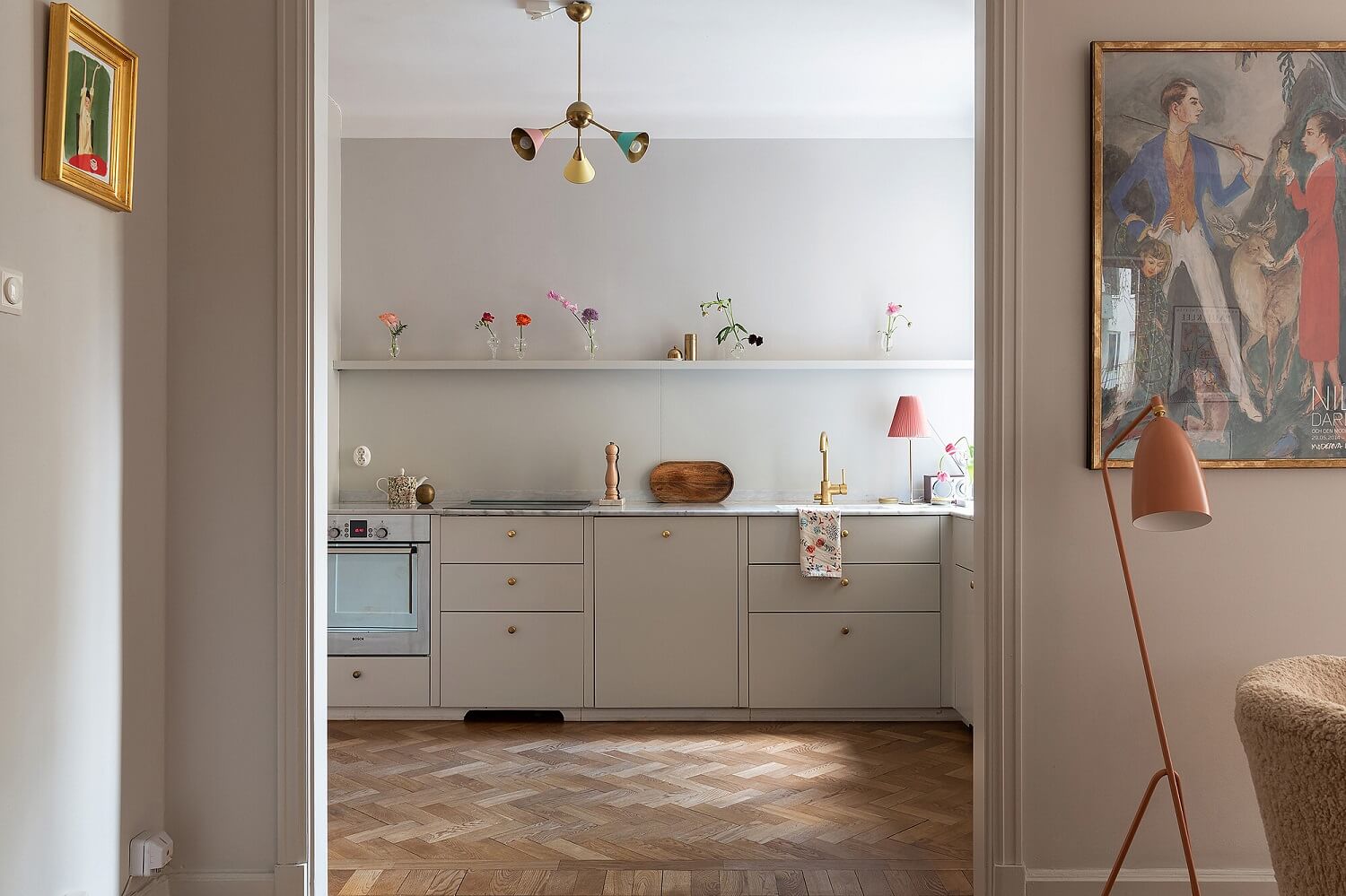 A Serene Nordic Apartment with Pink Color Accents 4 gray-scandinavian-kitchen-design-shelf-wooden-floor-nordroom