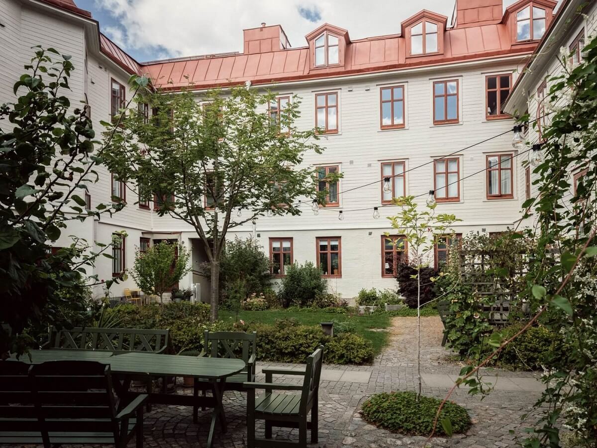 A Scandinavian Duplex That Blends Old and New 22 green-courtyard-swedish-apartment-complex-nordroom