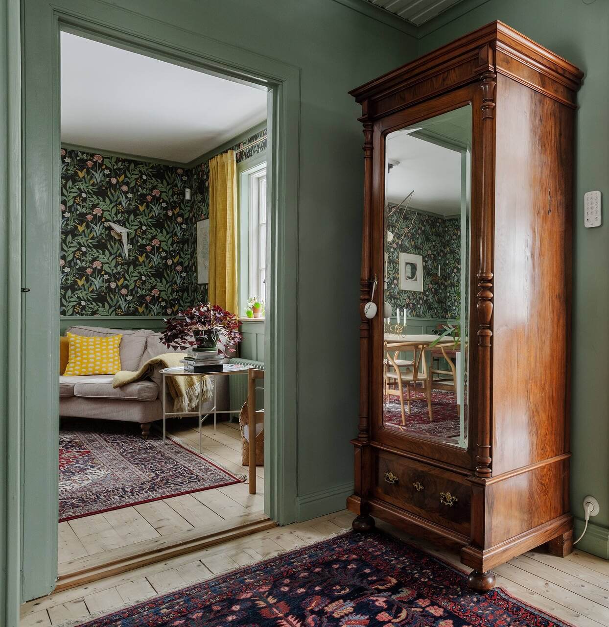Green Tones and Wallpaper in a Charming Swedish Home 10 green-hallway-antique-mirror-wardrobe-nordroom