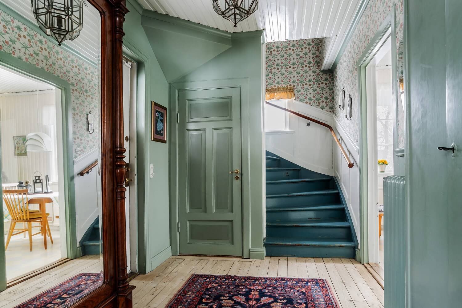 Green Tones and Wallpaper in a Charming Swedish Home 11 green-hallway-blue-painted-stairs-nordroom
