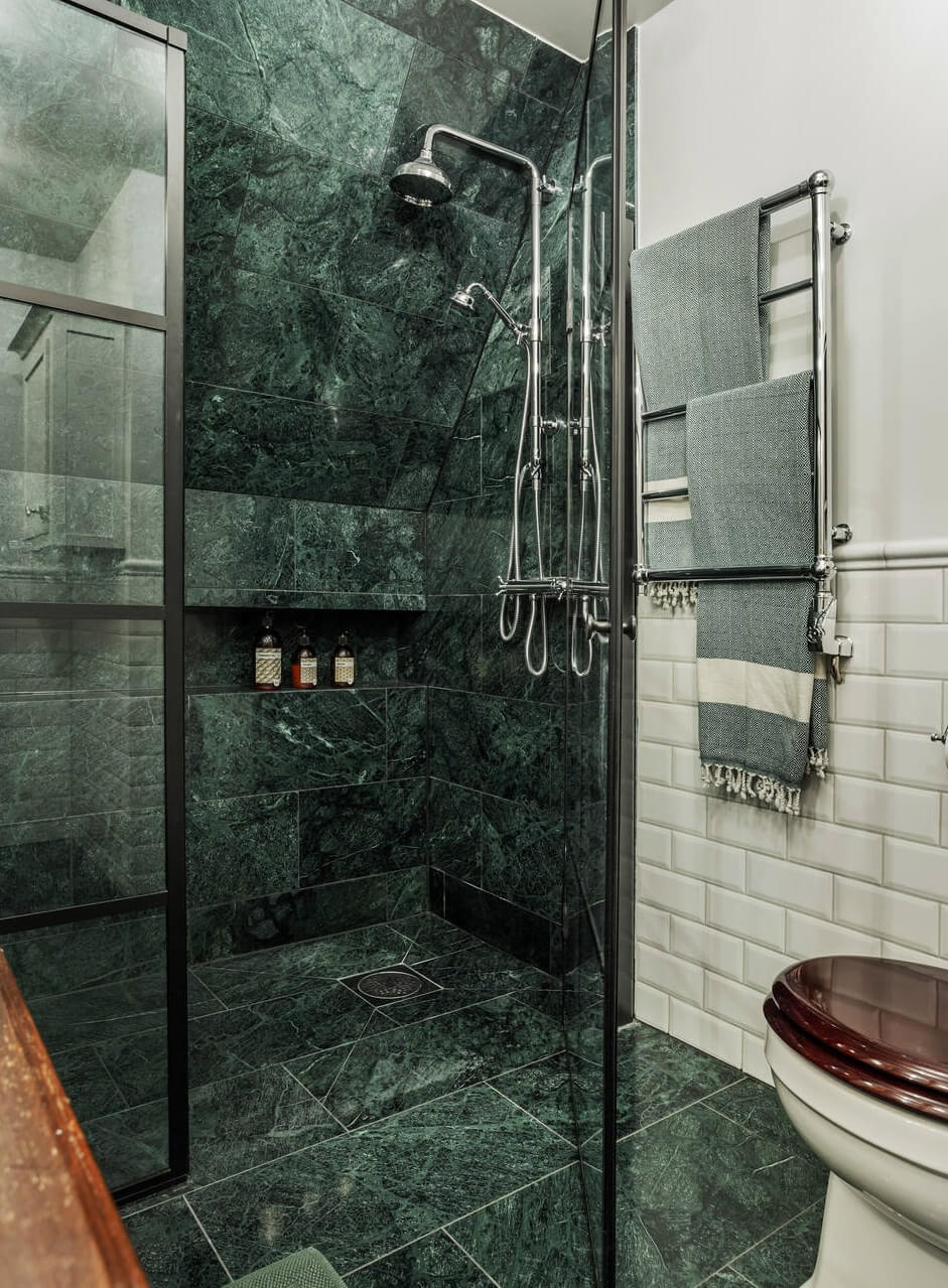 Green Tones and Wallpaper in a Charming Swedish Home 21 green-marble-shower-swedish-country-house-nordroom