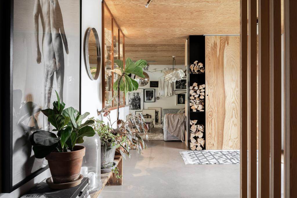 The Top Home Design Trends for 2026: Bold Color, Cozy Corners & Climate-Ready Living 14 hallway-concrete-floor-sustainable-nordic-home-nordroom