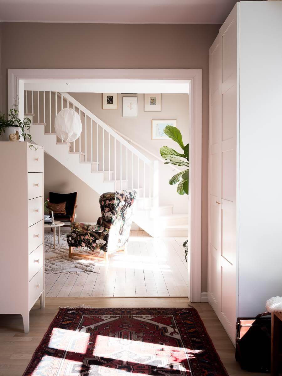 A Scandinavian Duplex That Blends Old and New 6 hallway-red-rug-closets-nordroom