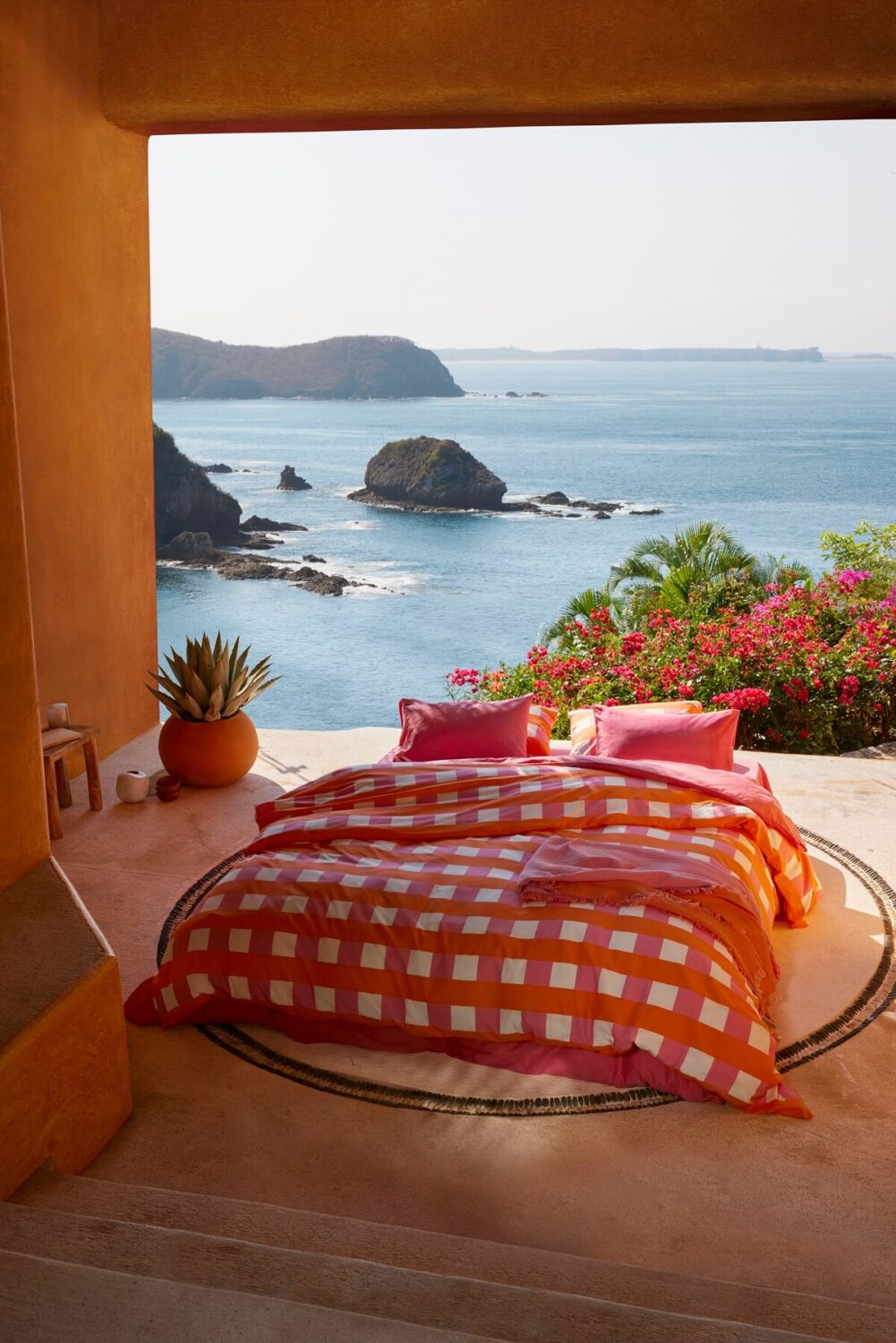H&M Home Summer Collection 2023: Vibrant Decor 11 hm-home-summer-collection-outdoor-bed-pink-bedding-sea-view-nordroom