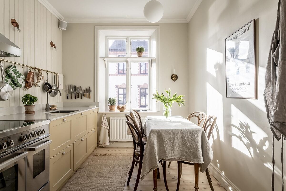 Glidden & PPG Color of the Year 2024: Limitless 26 kitchen-dining-table-pale-yellow-cabinets-nordroom