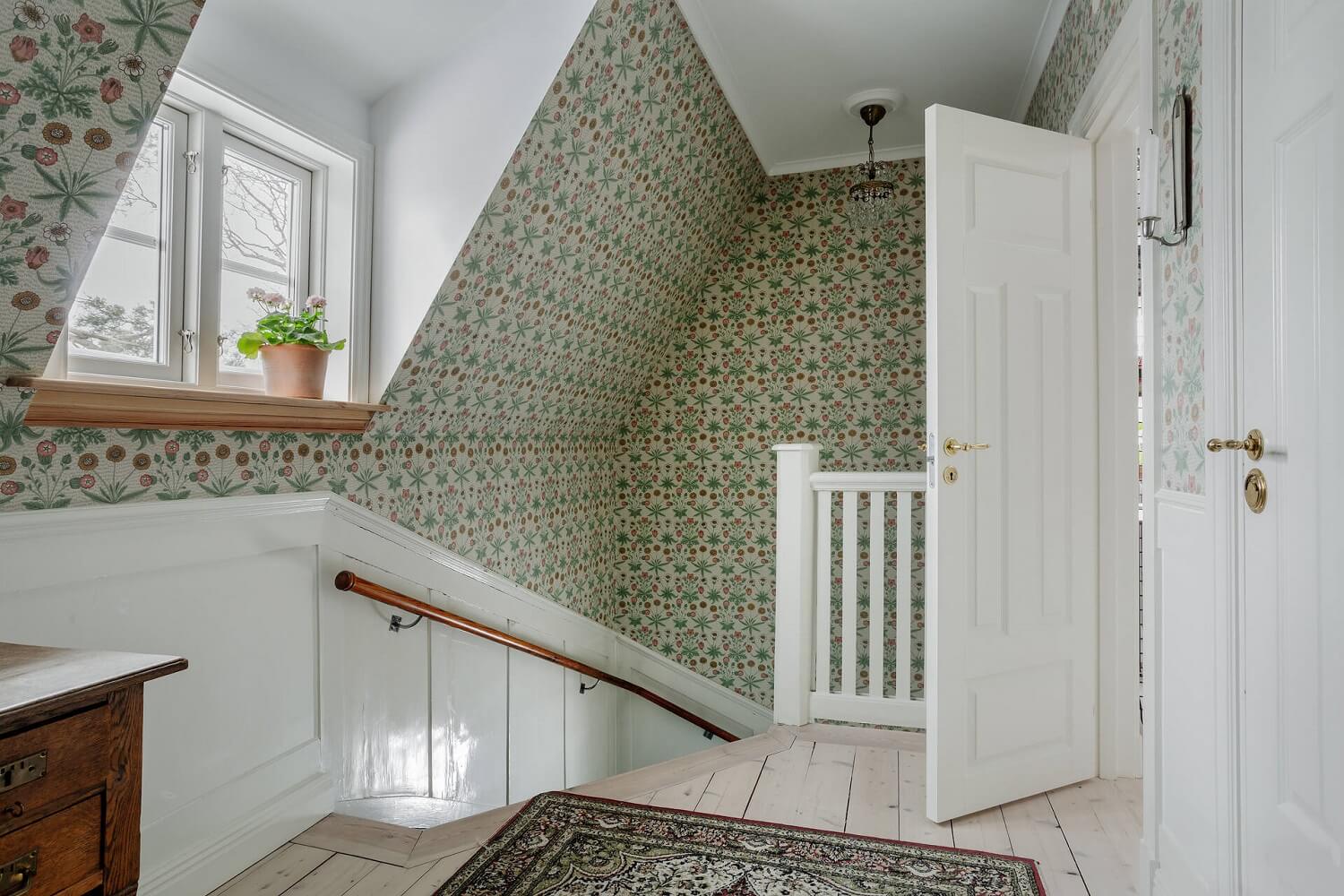 Green Tones and Wallpaper in a Charming Swedish Home 17 landing-slanted-ceiling-wallpaper-nordroom