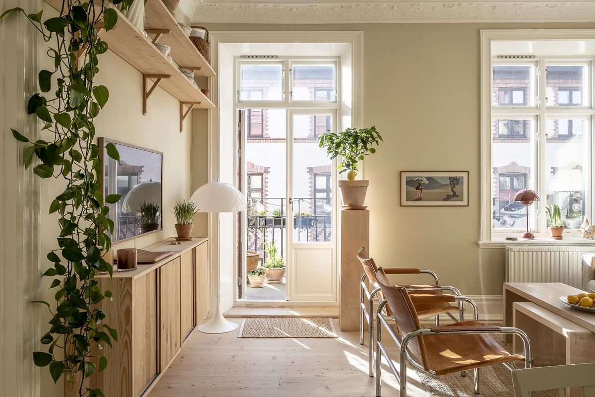 A Scandinavian Apartment with a Pale Yellow Kitchen 4 living-room-double-doors-balcony-ivar-cabinets-nordroom