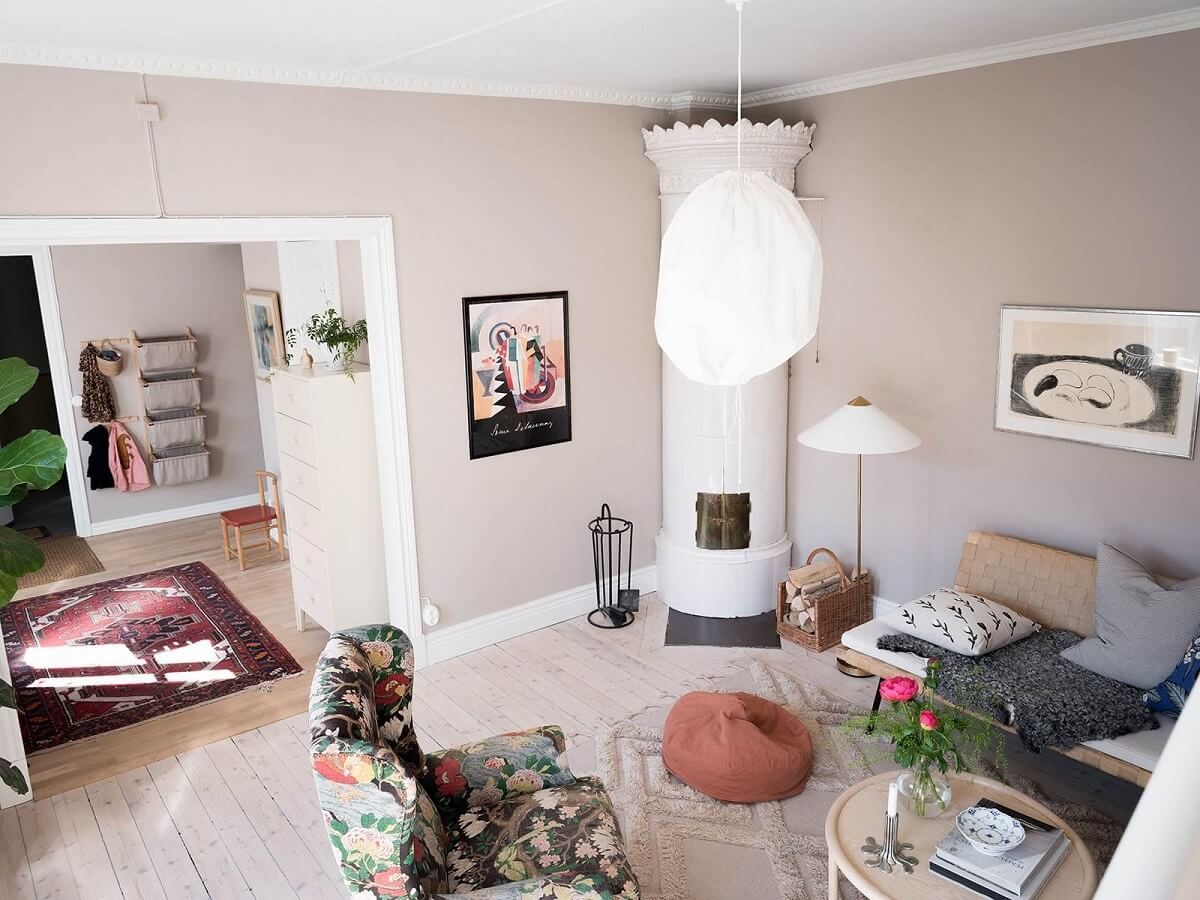 A Scandinavian Duplex That Blends Old and New 4 living-room-gray-wall-round-fireplace-wooden-floor-nordroom