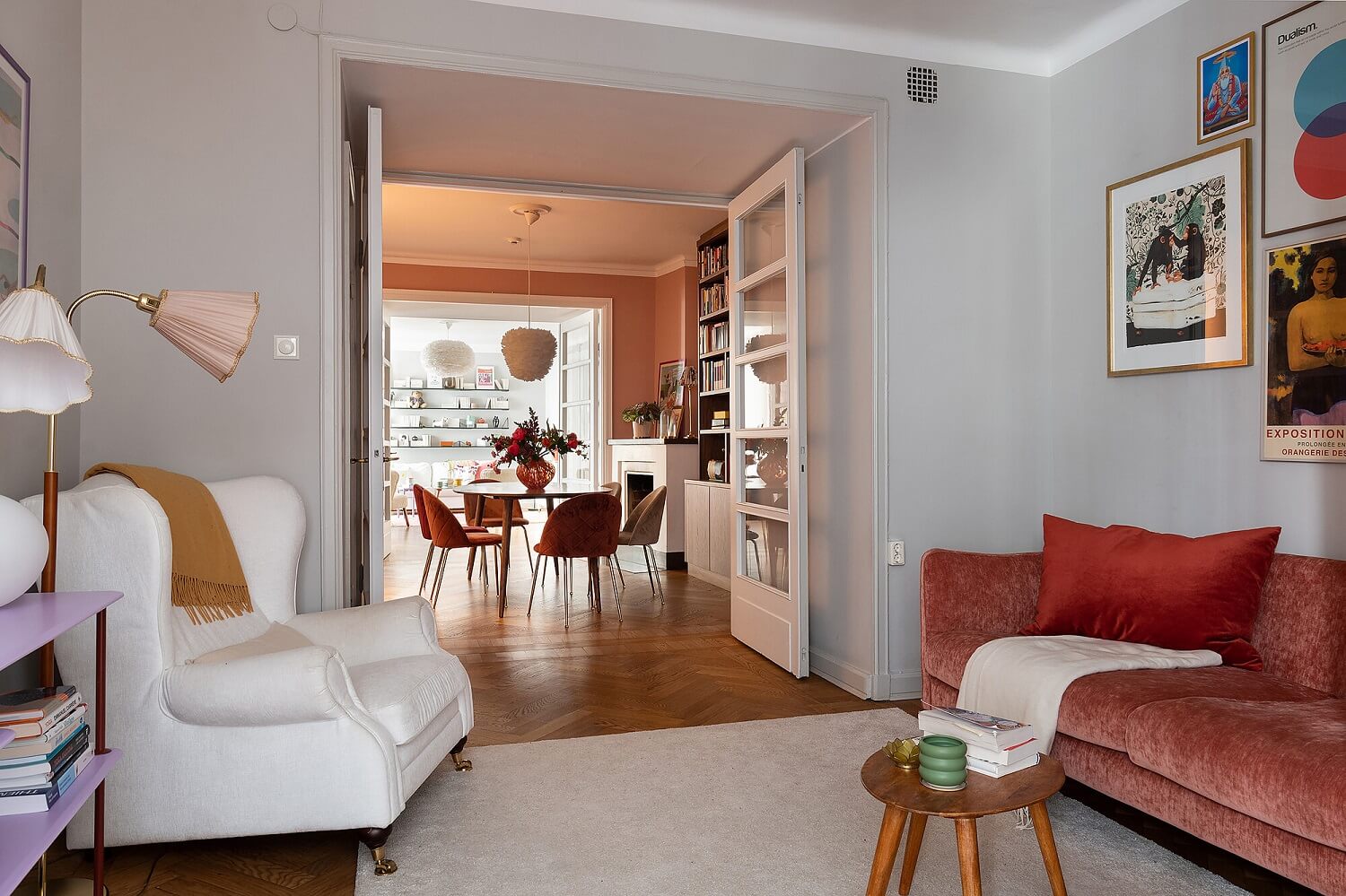 A Serene Nordic Apartment with Pink Color Accents 16 living-room-gray-walls-red-sofa-nordroom