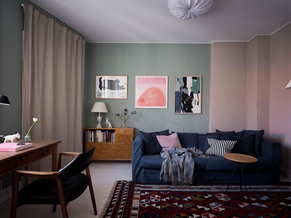A Scandinavian Duplex That Blends Old and New 12 living-room-half-painted-walls-blue-couch-rug-nordroom
