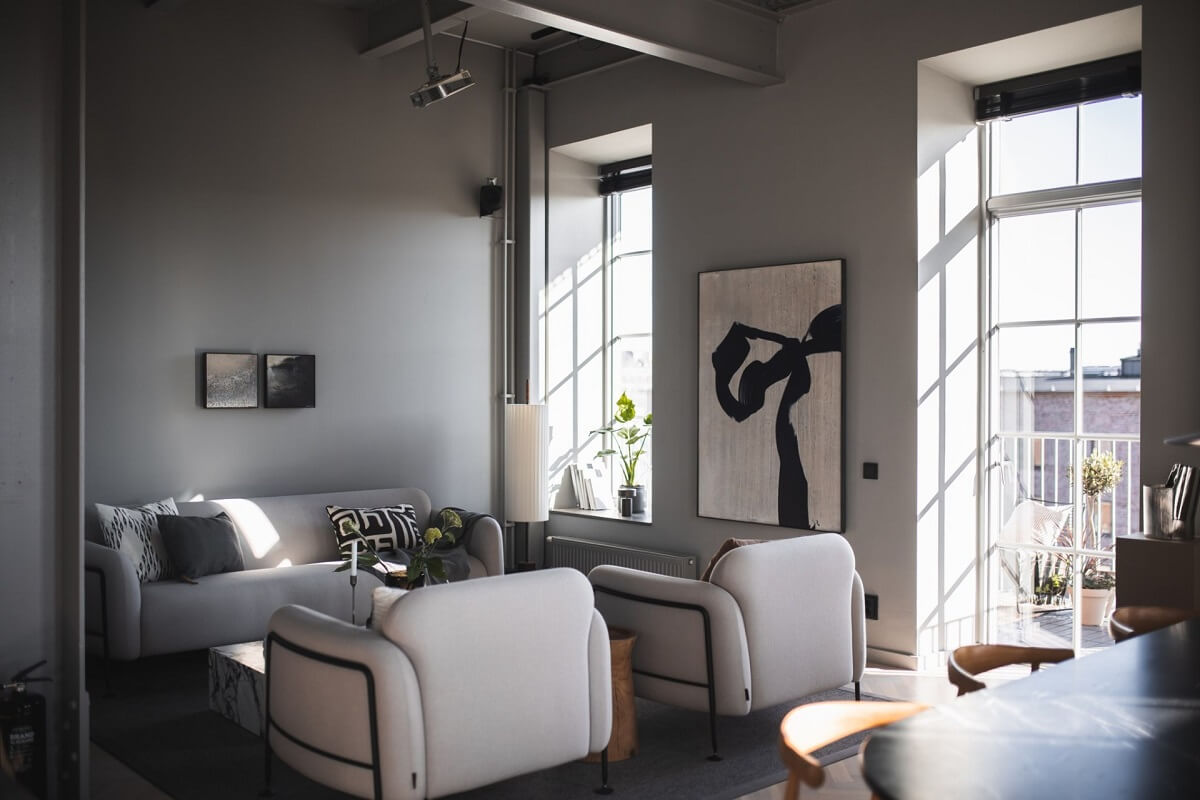 A Modern Gray Industrial Apartment 5 living-room-high-ceilings-light-gray-walls-nordroom