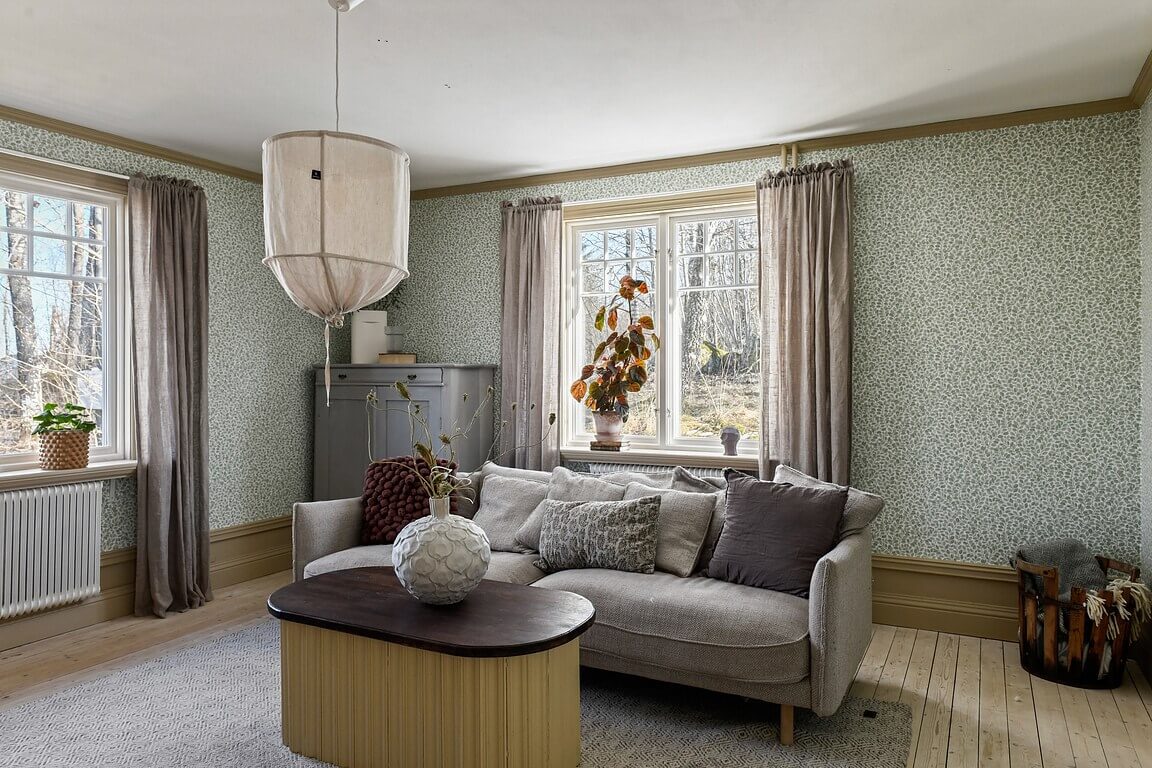 An Idyllic Family Home in the Swedish Countryside 12 living-room-muted-color-palette-wooden-floor-nordroom
