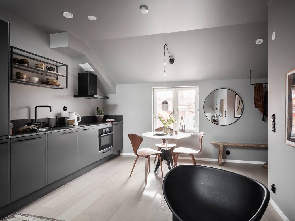 A Small Gray Attic Apartment in Sweden 8 modern-dark-gray-kitchen-nordic-design-attic-apartment-nordroom