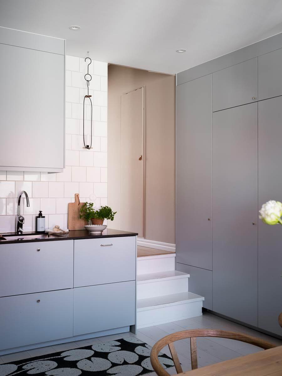 A Scandinavian Duplex That Blends Old and New 10 modern-kitchen-bluegray-cupboards-floor-to-ceiling-cabinets-nordroom