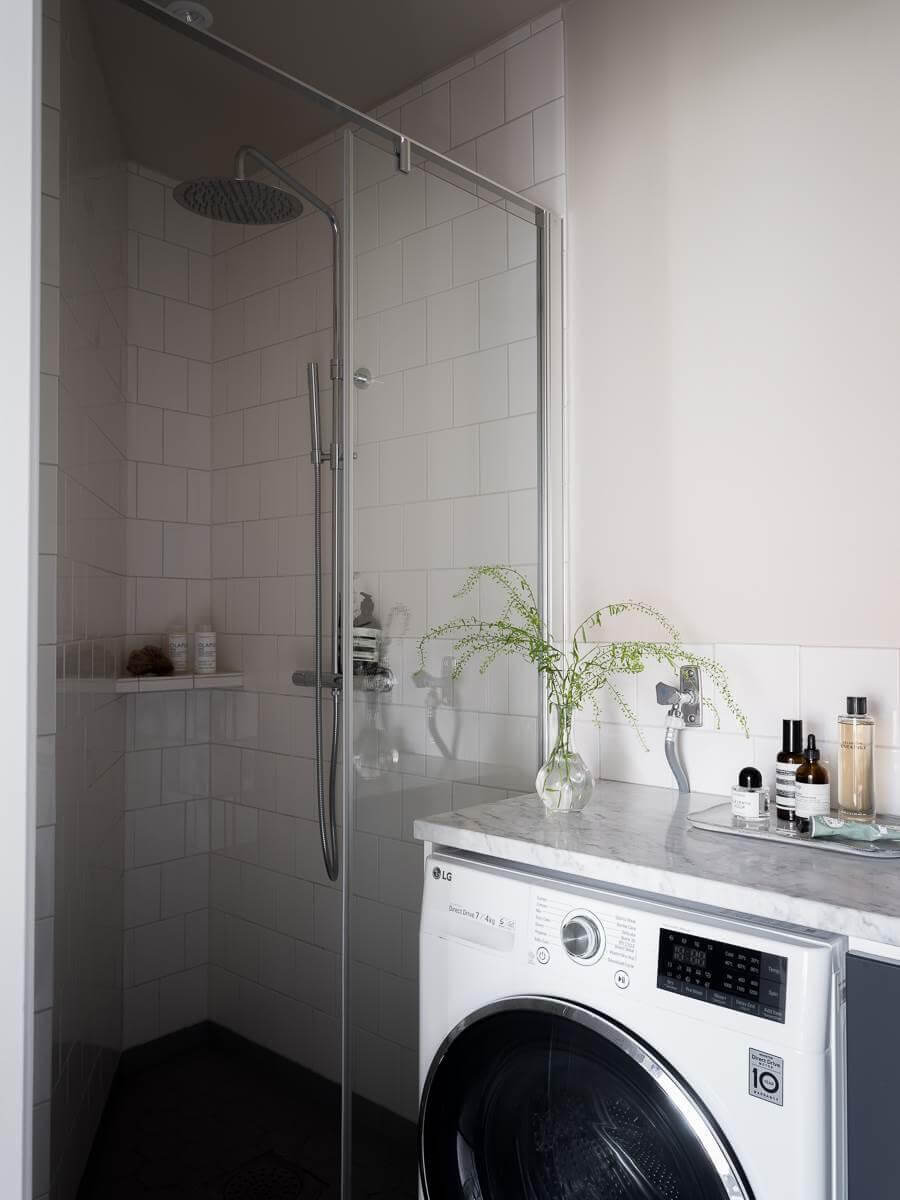 A Scandinavian Duplex That Blends Old and New 20 narrow-bathroom-corner-shower-nordroom