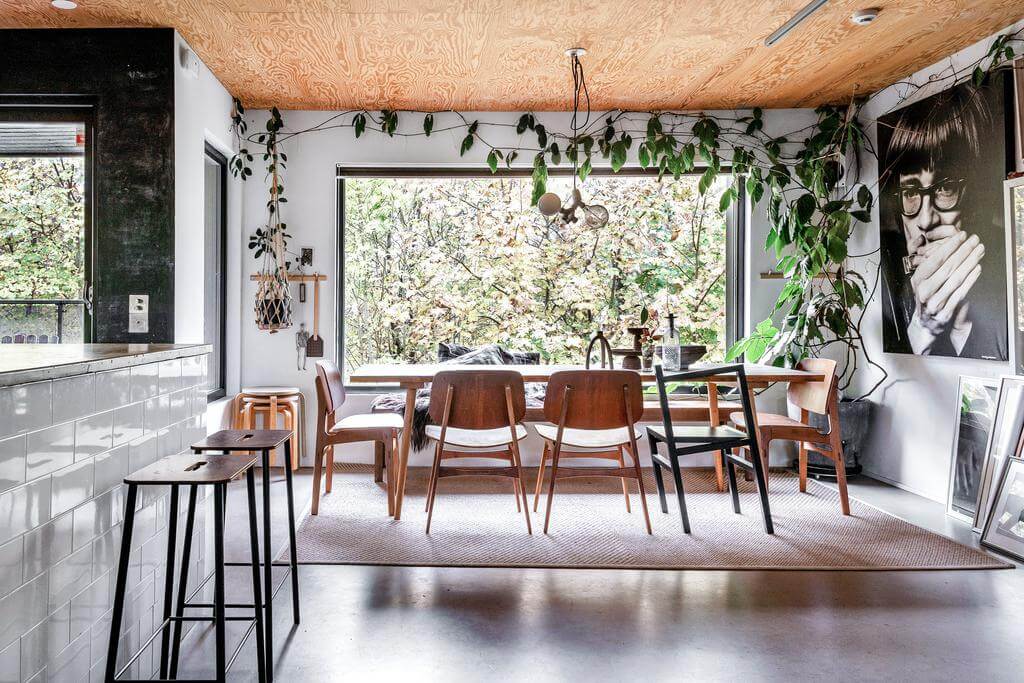 A Renovated Sustainable Home in Sweden 4 open-plan-living-room-dining-table-wooden-ceiling-nordroom