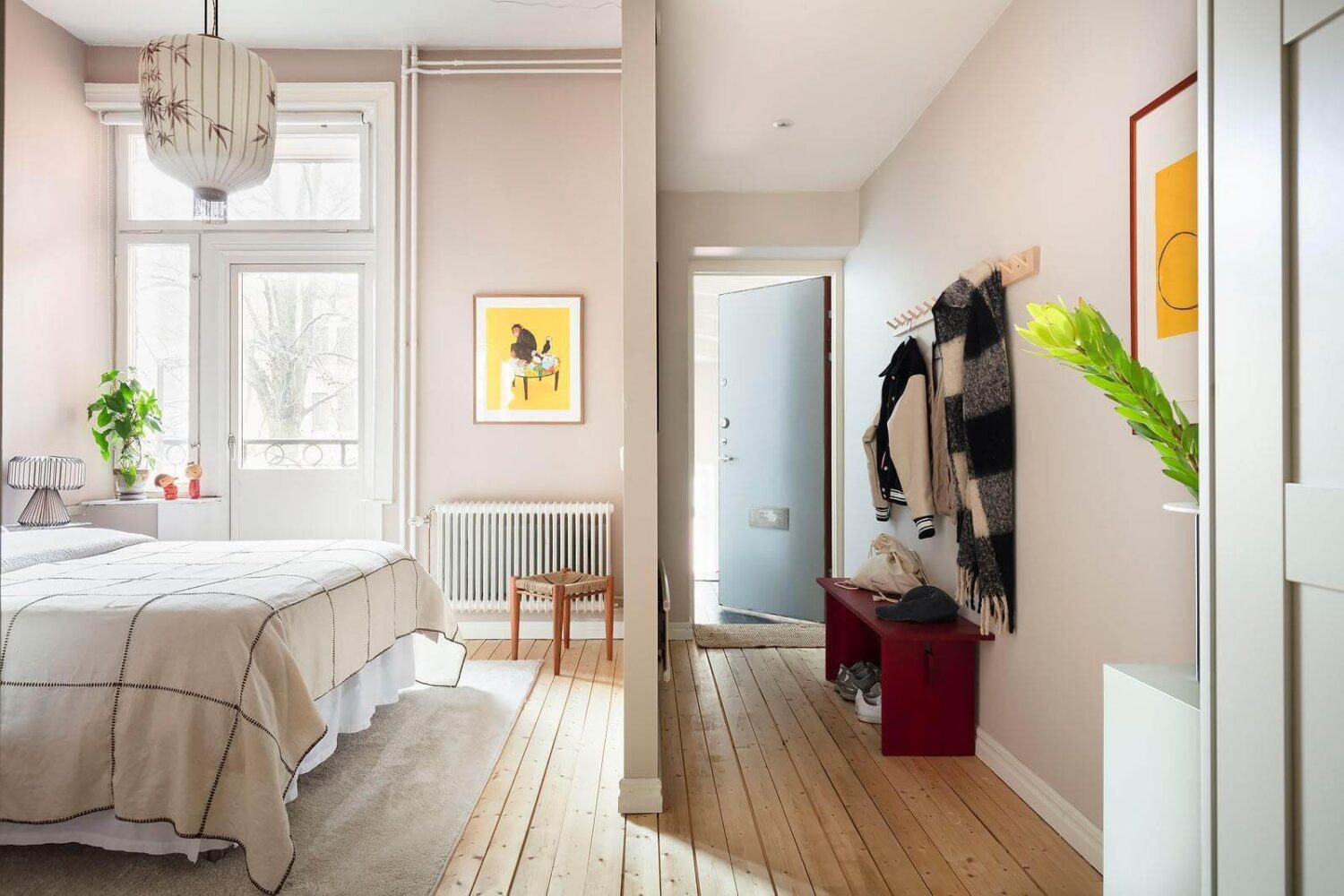 A Stylish Nordic Apartment with a Pink Bedroom 7 open-plan-master-bedroom-hallway-wooden-floor-nordroom