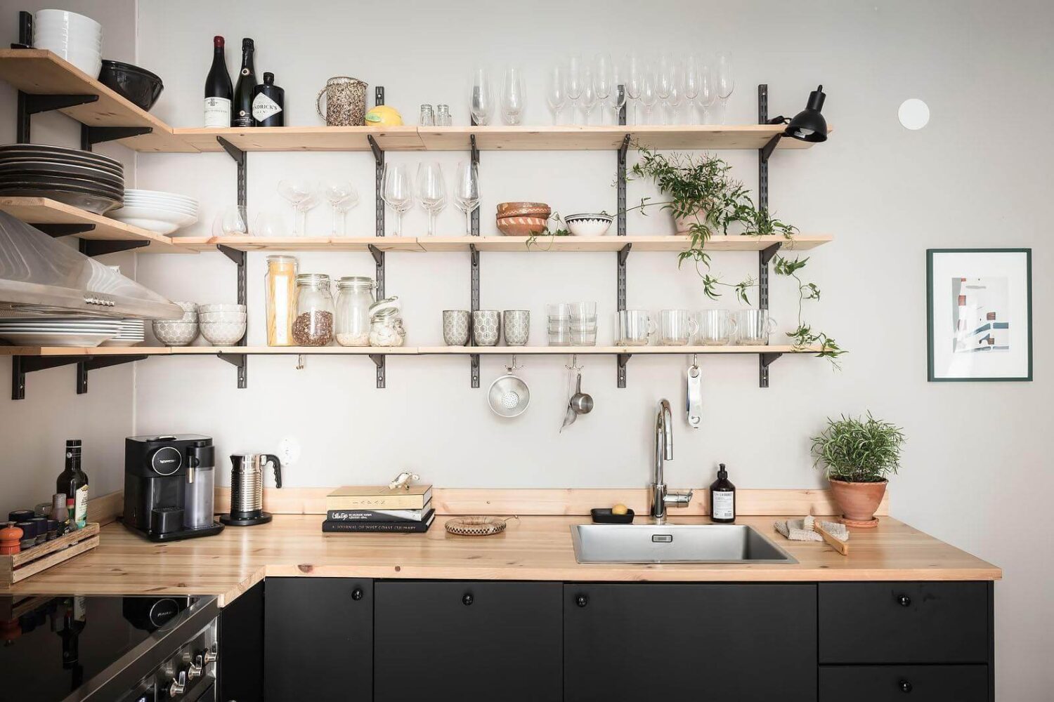 A Stylish Nordic Apartment with a Pink Bedroom 5 open-shelves-kitchen-black-cabinets-nordroom