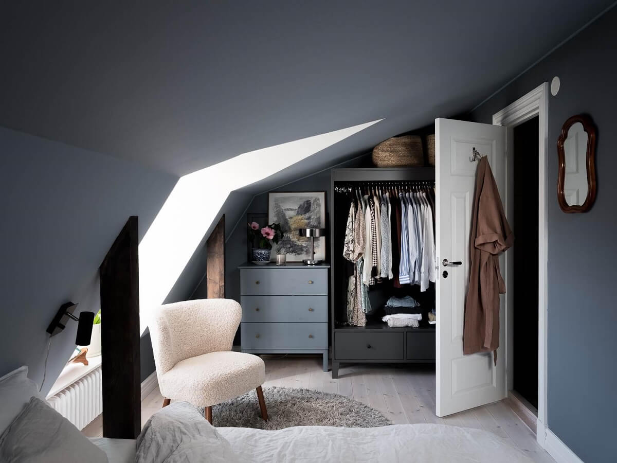 How To Decorate A Bedroom with A Slanted Ceiling 17 open-wardrobe-attic-apartment-blue-walls-nordroom