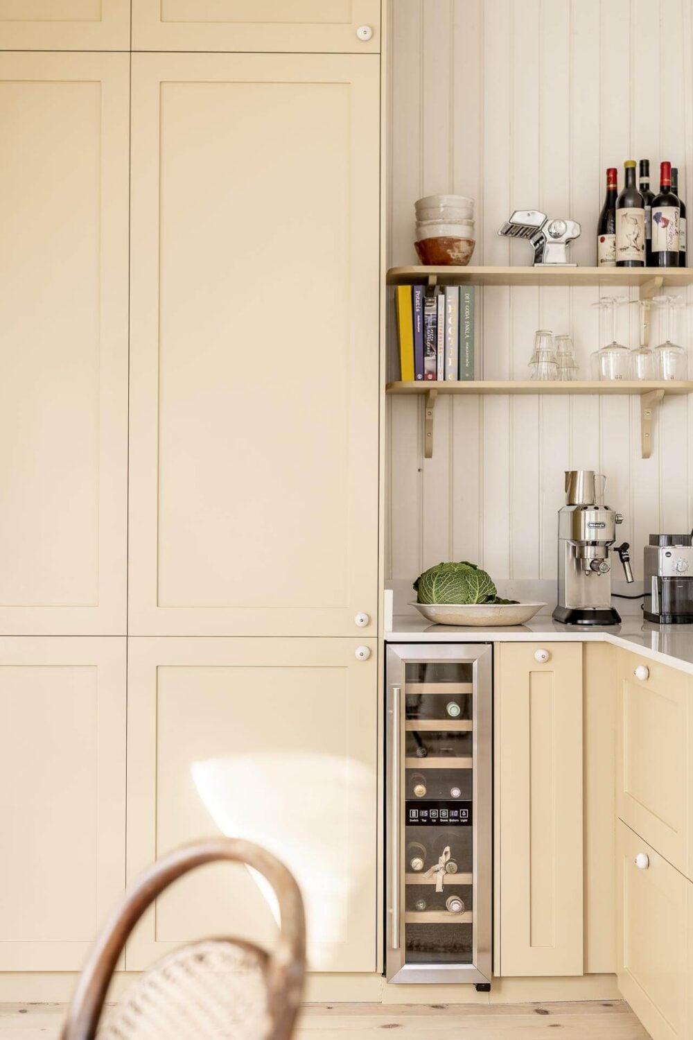 A Scandinavian Apartment with a Pale Yellow Kitchen 16 pale-yellow-kitchen-cabinets-open-shelves-nordroom