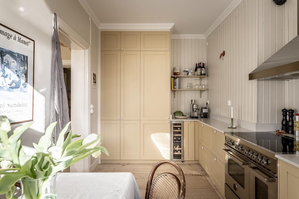 A Scandinavian Apartment with a Pale Yellow Kitchen 17 pale-yellow-kitchen-cupboards-nordroom