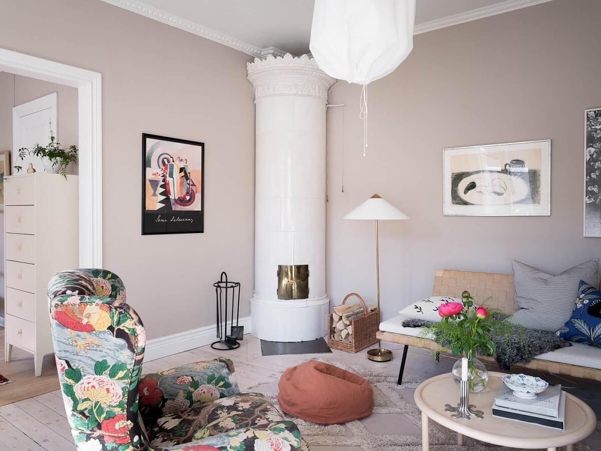 A Scandinavian Duplex That Blends Old and New 5 round-swedish-fireplace-gray-walls-nordic-design-nordroom