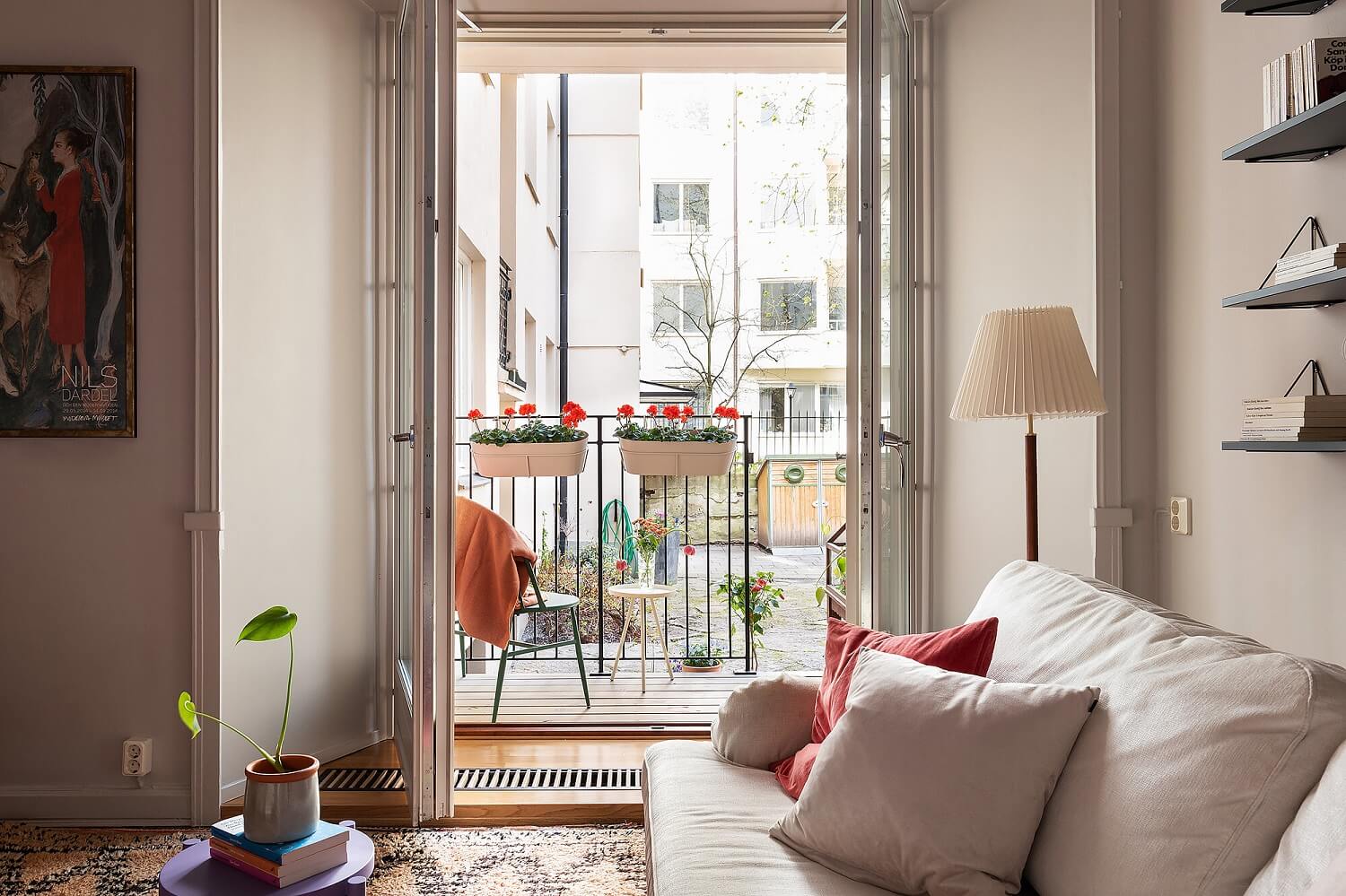 A Serene Nordic Apartment with Pink Color Accents 2 scandinavian-living-room-balcony-nordroom