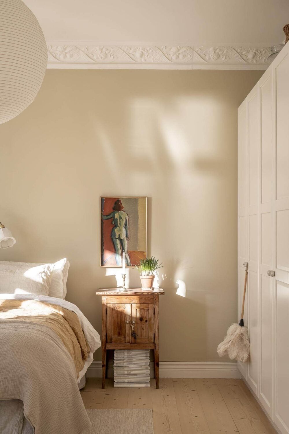 A Scandinavian Apartment with a Pale Yellow Kitchen 19 serene-bedroom-beige-walls-built-in-wardrobes-nordroom