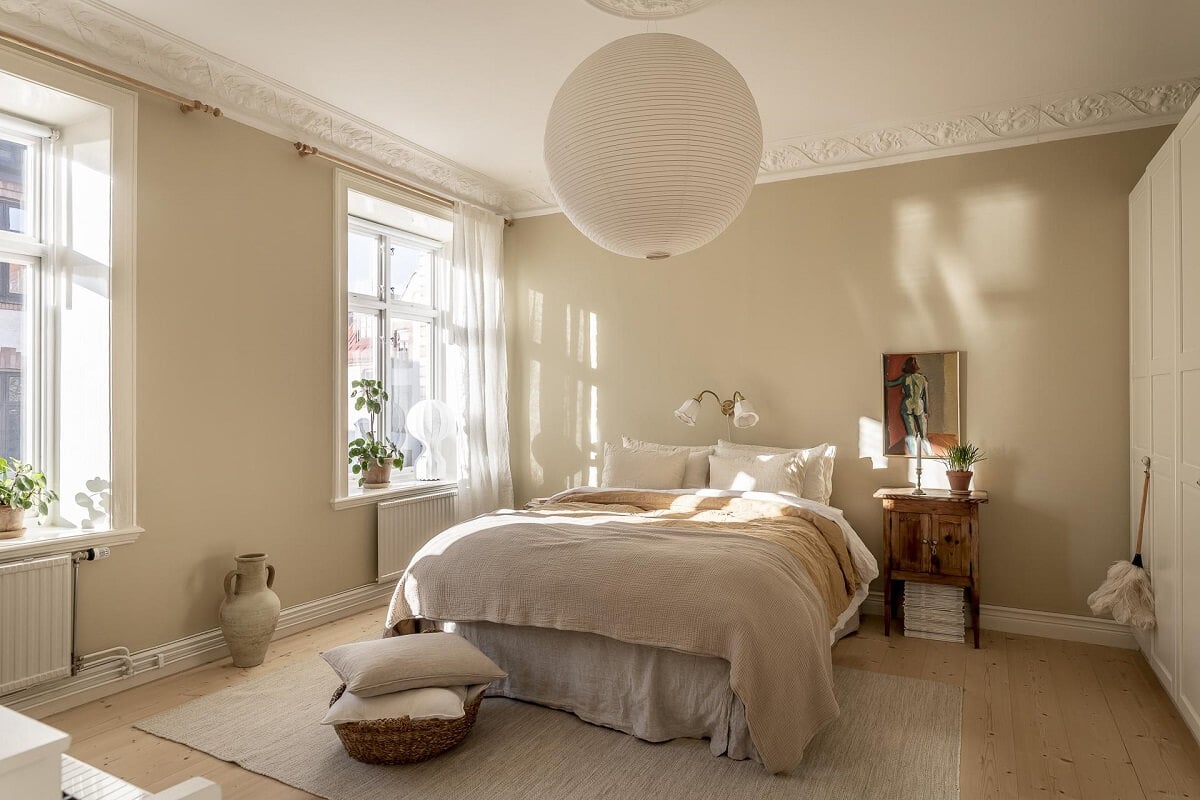 A Scandinavian Apartment with a Pale Yellow Kitchen 18 serene-bedroom-beige-walls-wooden-floor-nordroom