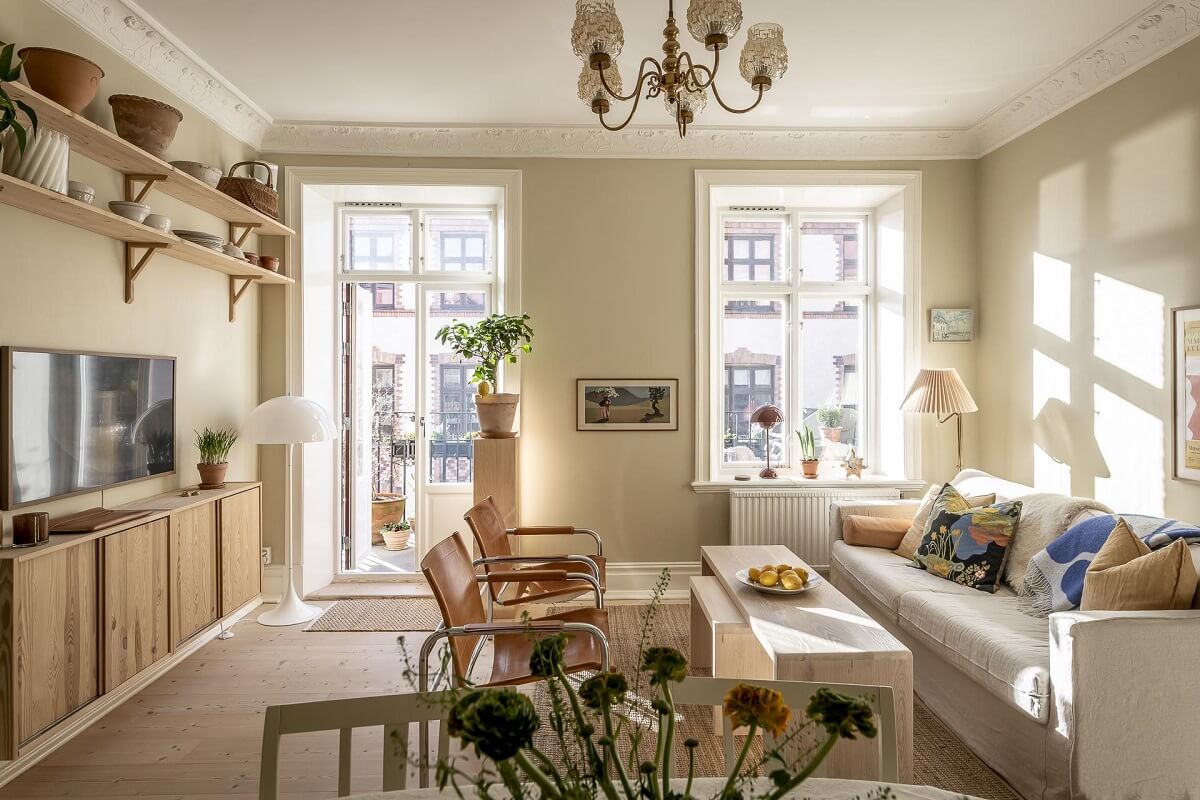 A Scandinavian Apartment with a Pale Yellow Kitchen 3 serene-living-room-natural-light-shelves-nordroom