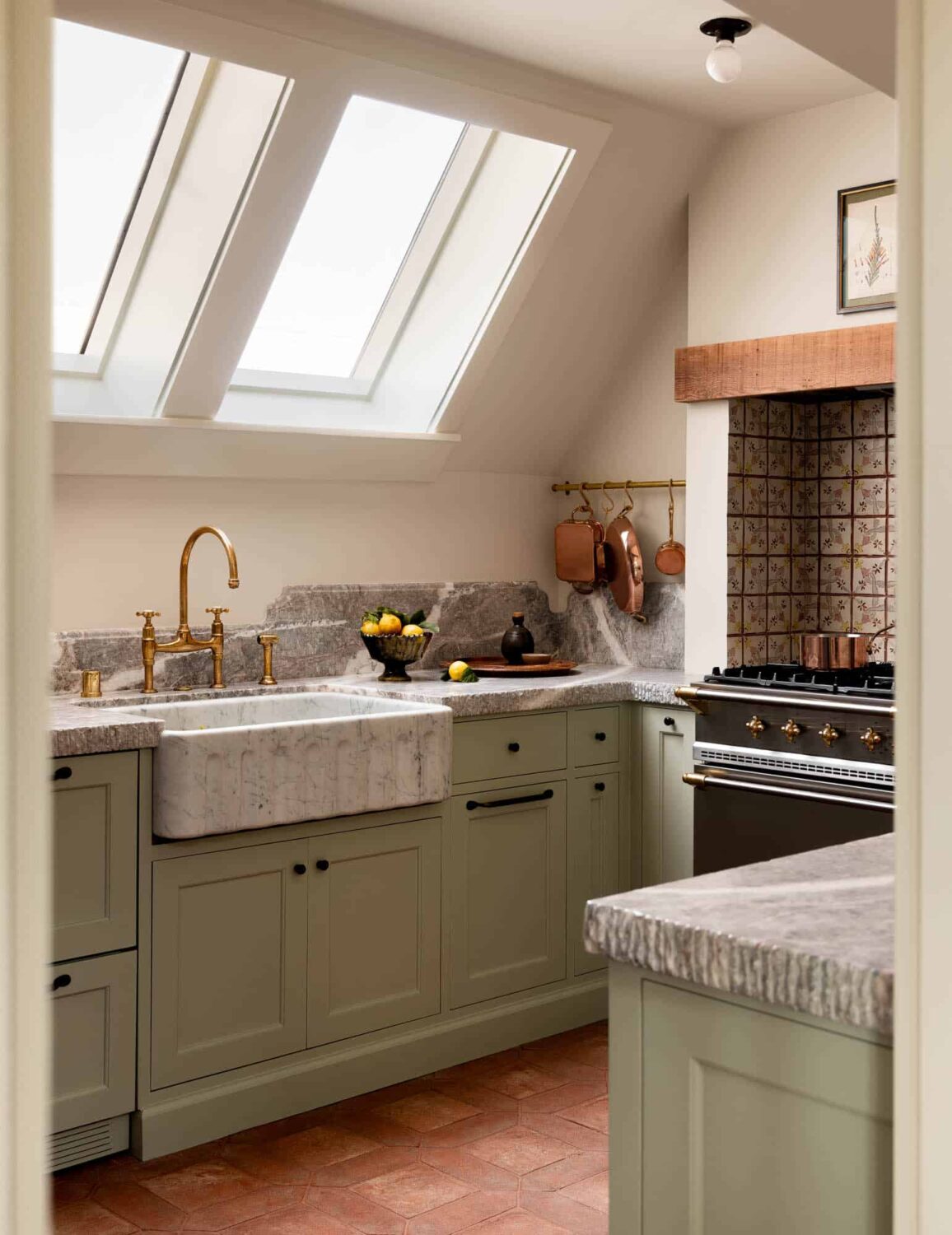 A Cozy Pied-à-Terre with Slanted Ceilings and Wallpaper 9 slanted-ceiling-skyights-kitchen-light-green-cabinets-marble-sink-nordroom