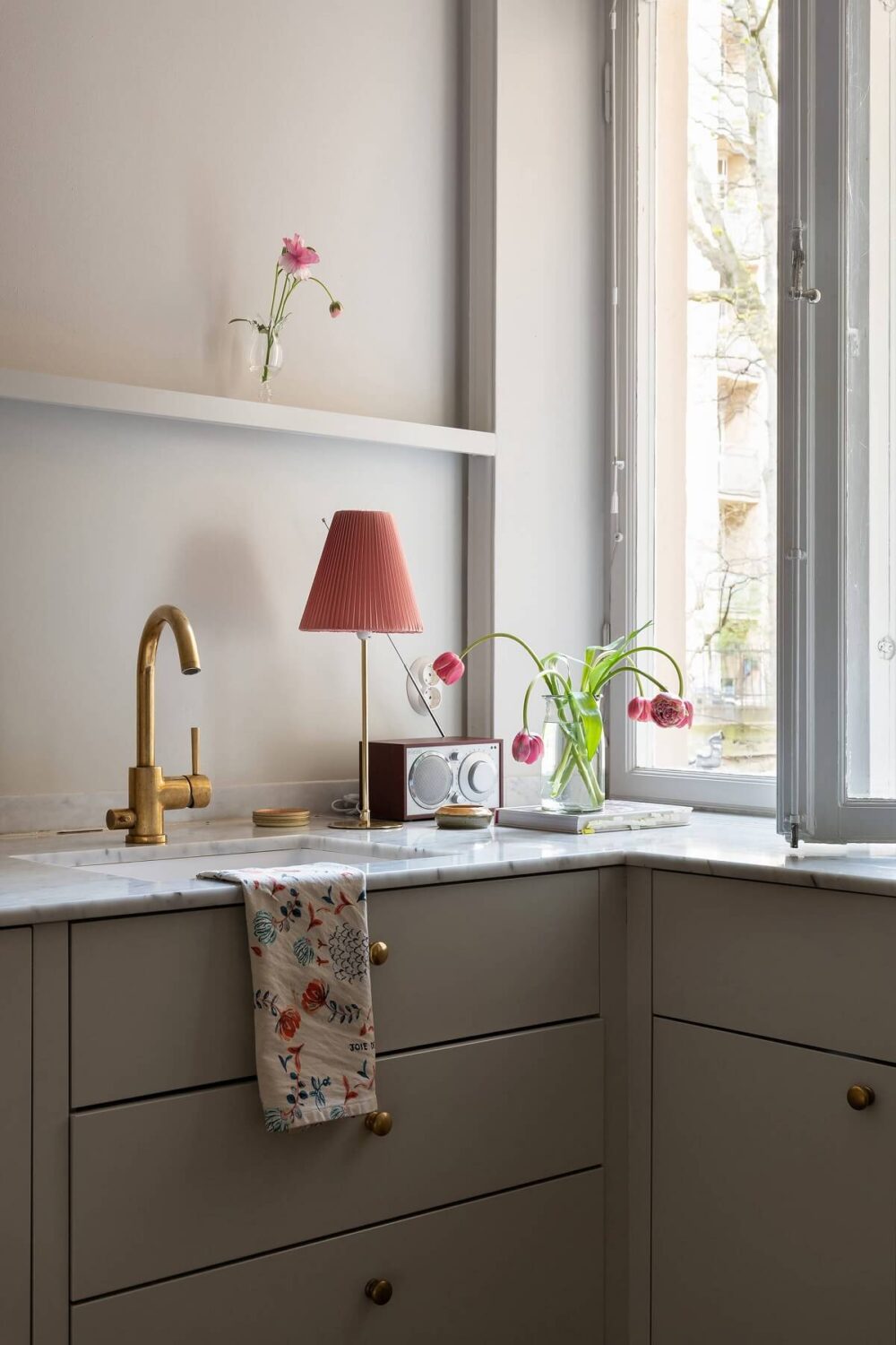 A Serene Nordic Apartment with Pink Color Accents 6 sleek-minimalistic-kitchen-gray-cabinets-nordroom