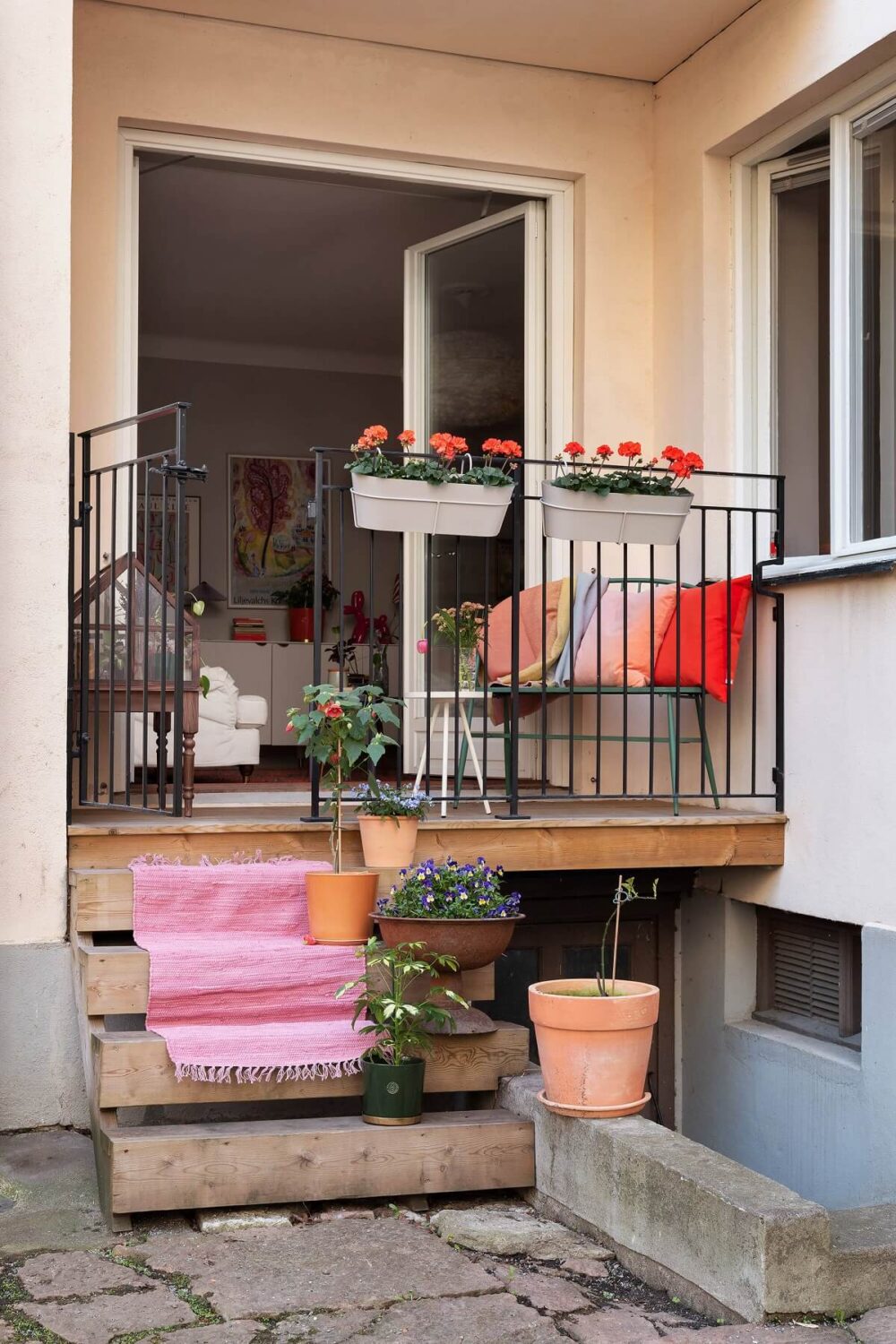 A Serene Nordic Apartment with Pink Color Accents 8 small-balcony-scandinavian-apartment-nordroom