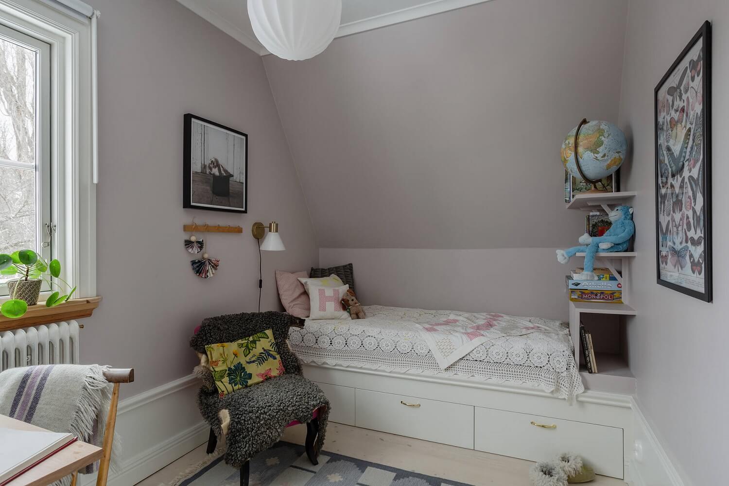 Green Tones and Wallpaper in a Charming Swedish Home 18 small-children-room-slanted-ceiling-nordroom