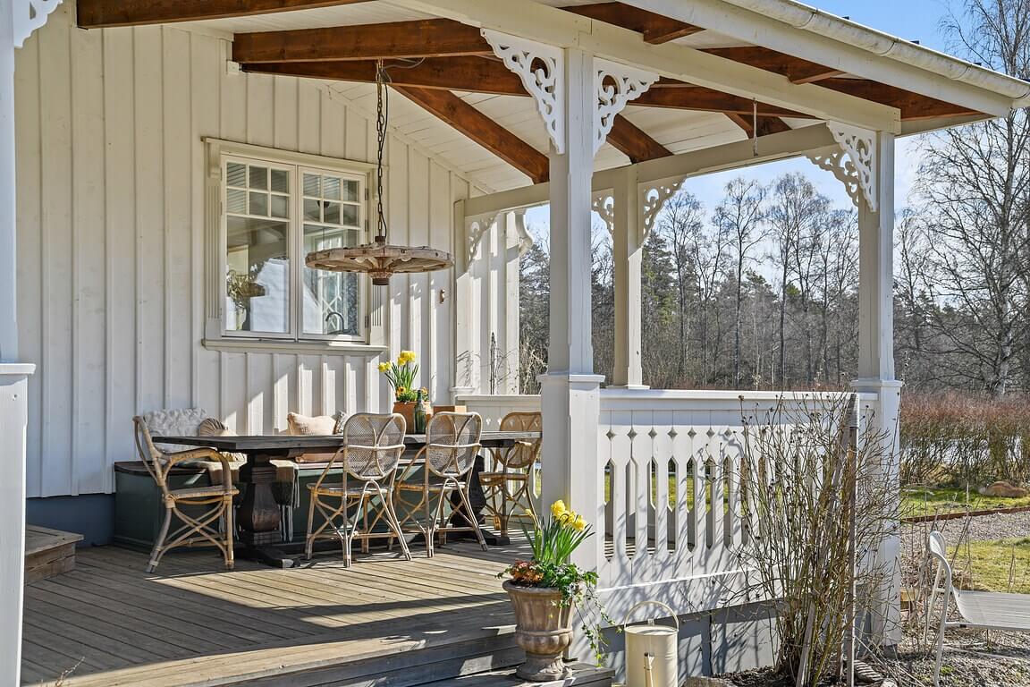 An Idyllic Family Home in the Swedish Countryside 23 veranda-dining-space-white-farmhouse-sweden-nordroom