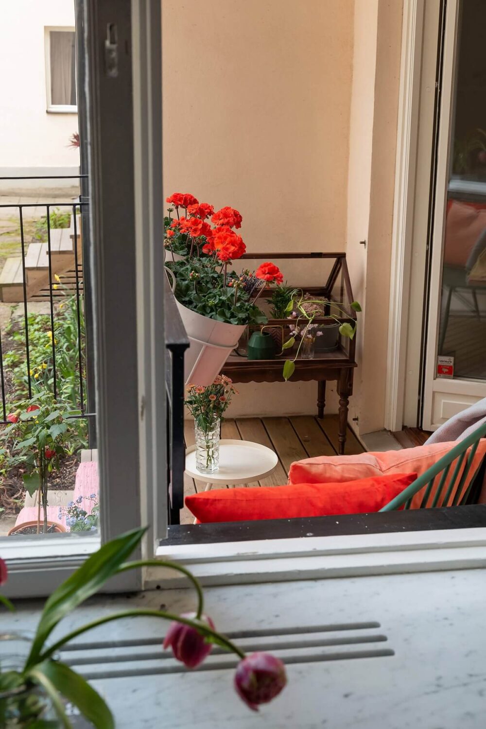 A Serene Nordic Apartment with Pink Color Accents 7 view-from-kitchen-on-balcony-nordroom