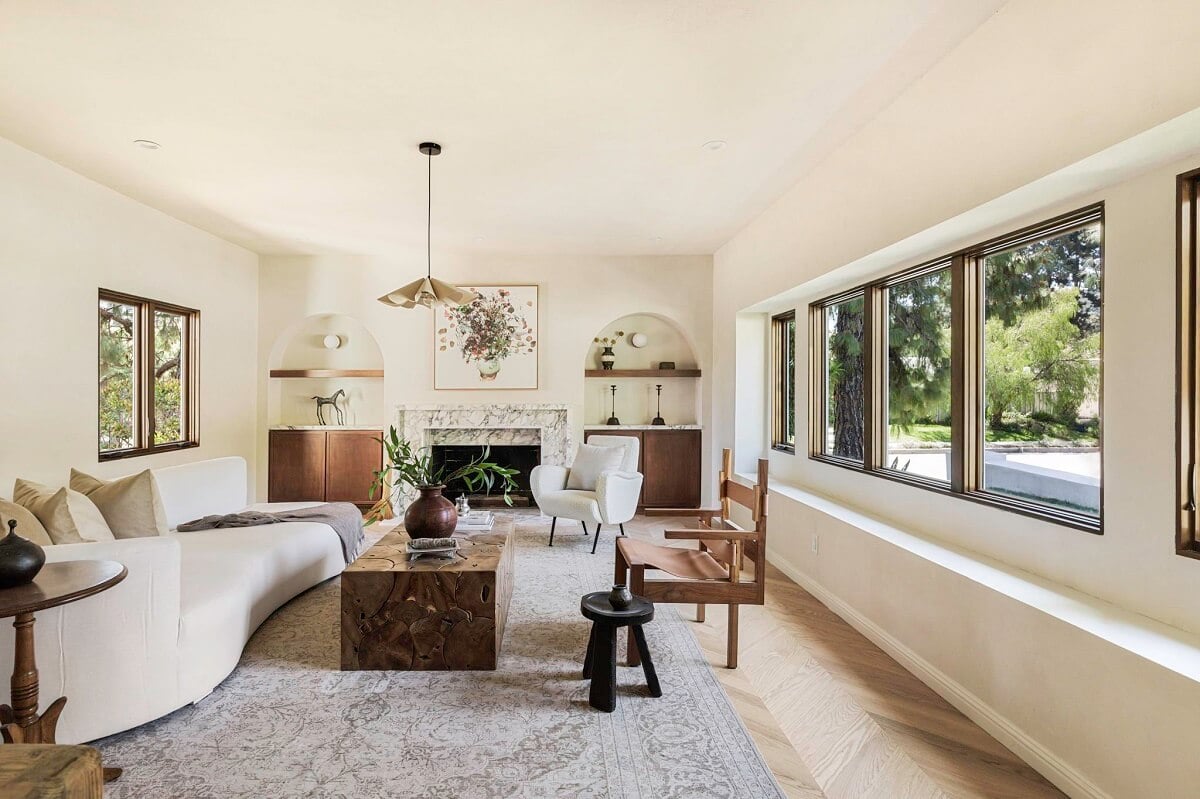 A Beautiful Serene Home in Encino Hills 14 white-living-room-curved-sofa-marble-fireplace-nordroom