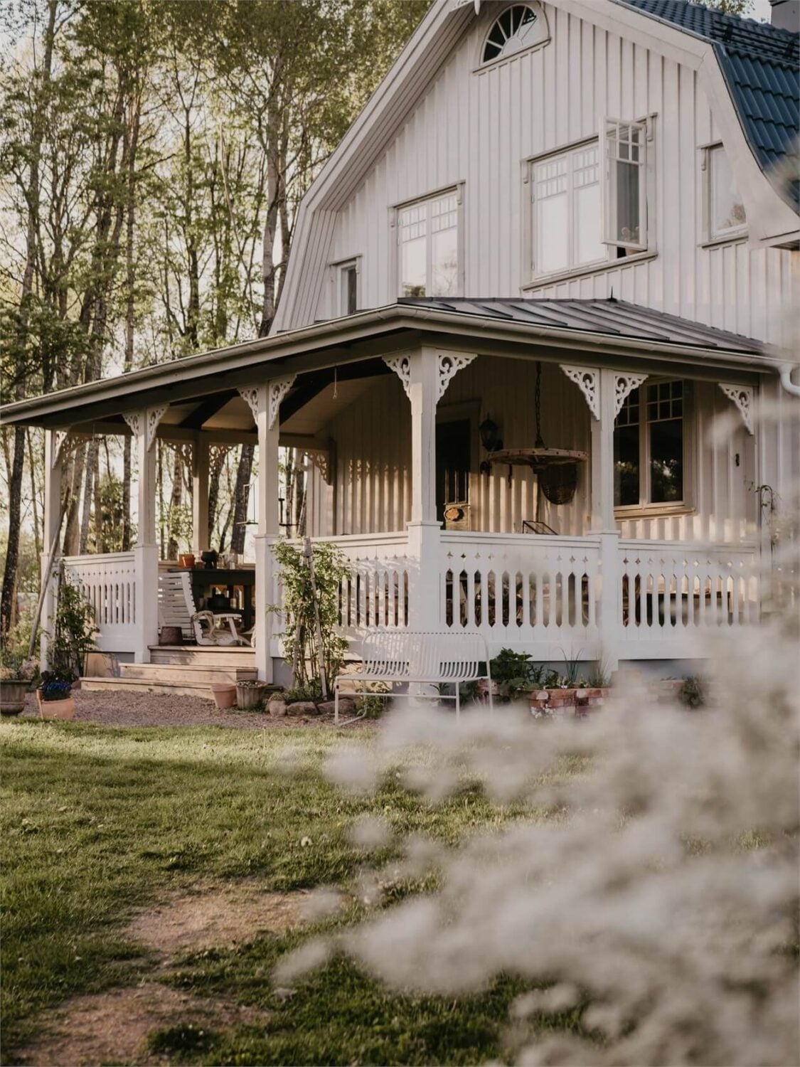 An Idyllic Family Home in the Swedish Countryside 1 white-swedish-country-house-veranda-flower-garden-nordroom