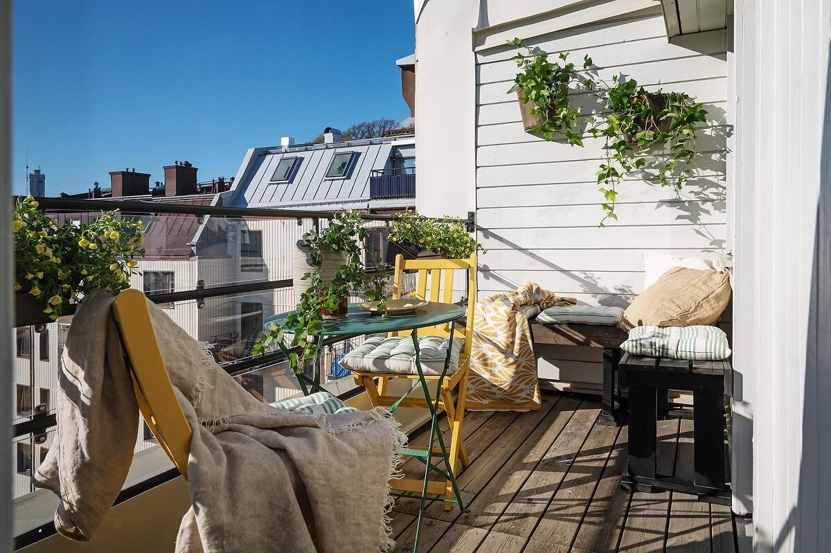 A Modern Scandinavian Attic Apartment 20 balcony-colorful-bistro-chairs-table-nordroom