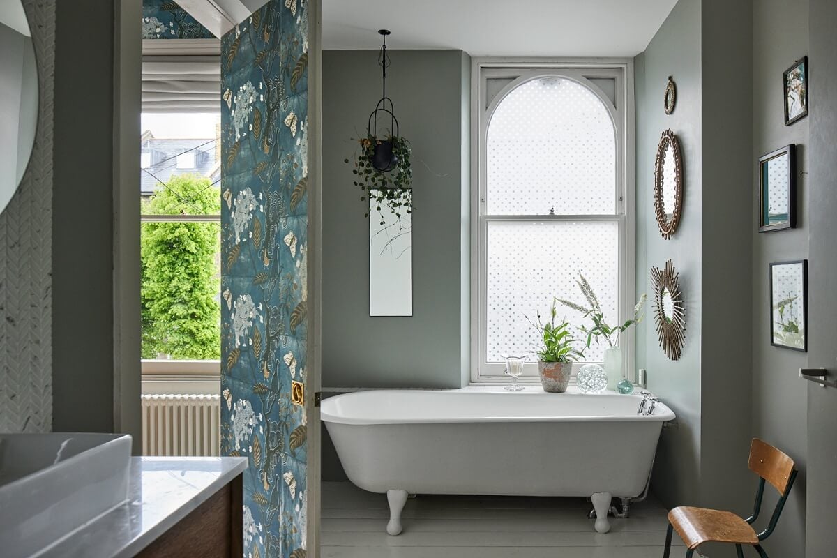 A Light Victorian Townhouse with Teal Reading Room 16 bathroom-light-gray-walls-freestanding-bath-arched-window-nordroom