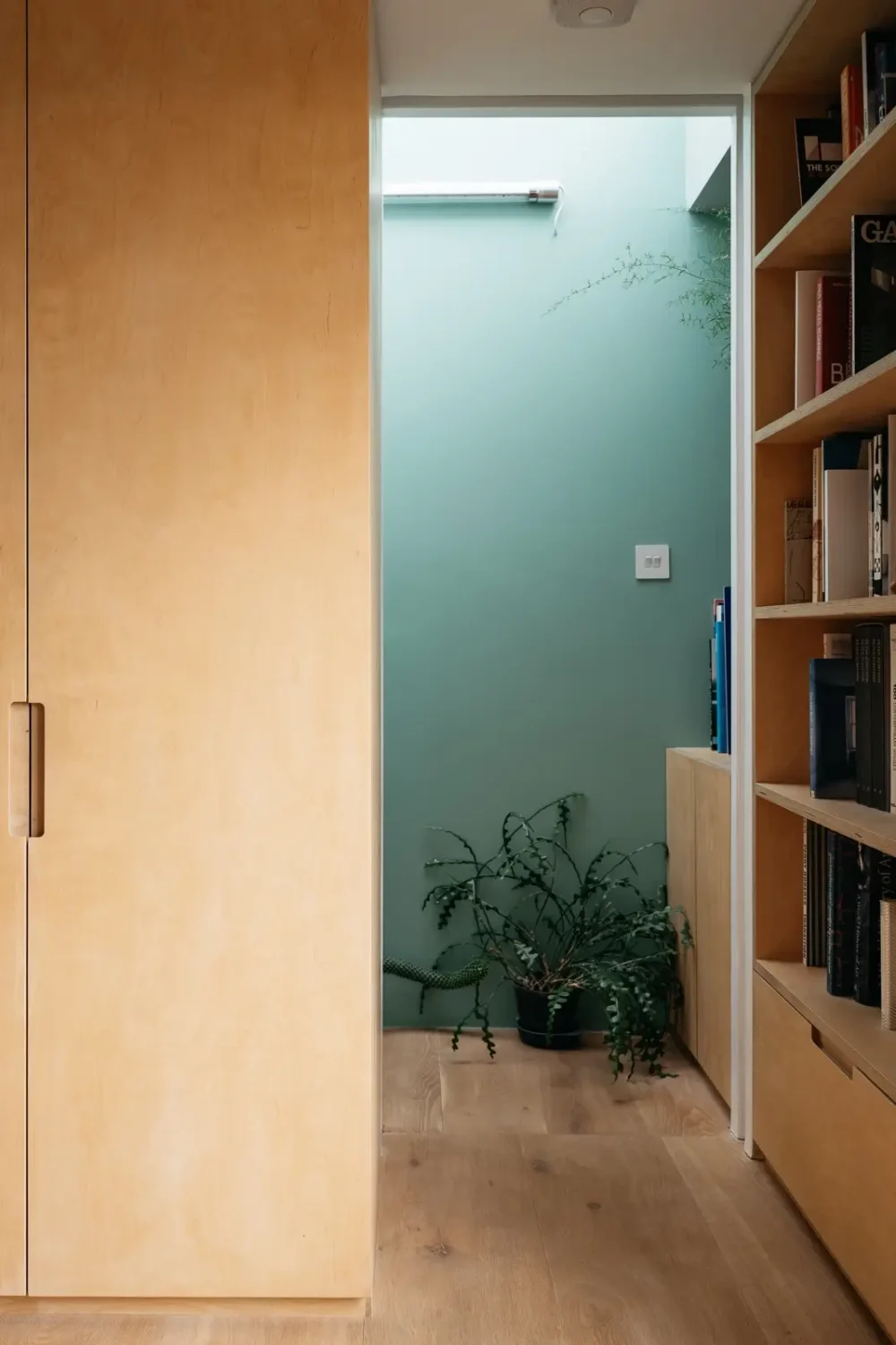 Modern Custom Interiors in a Victorian Home 16 bedroom built in closets bookshelves blue painted hallway nordroom