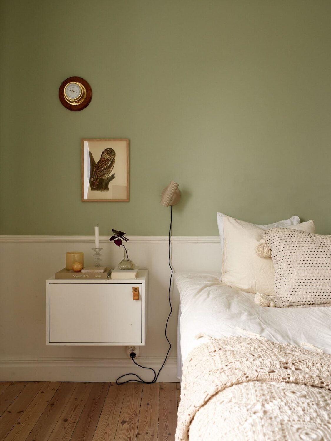A Scandinavian Apartment with a Light Green Bedroom 16 bedroom-floating-cabinets-nightstand-green-walls-white-bedding-nordroom