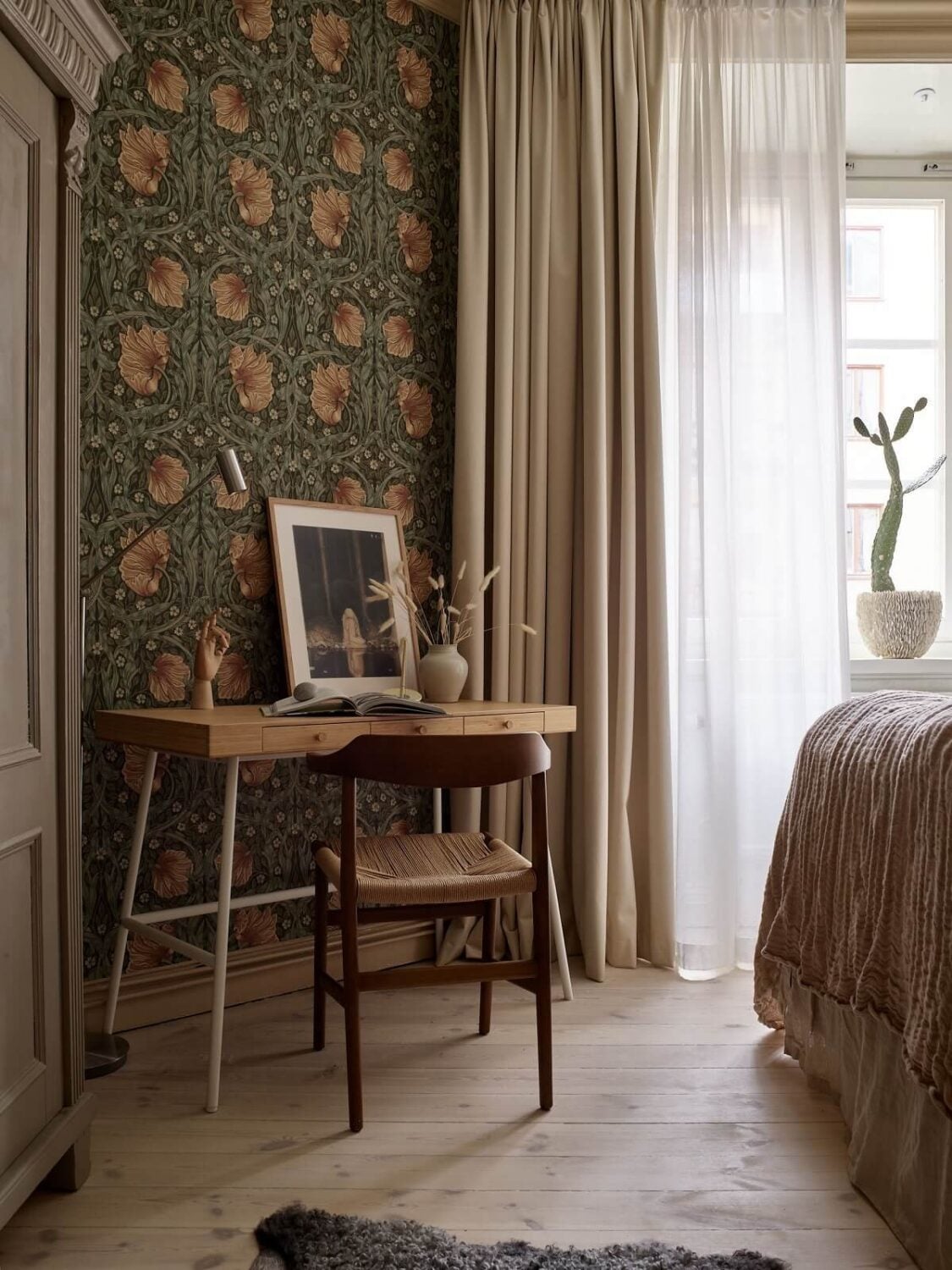 Warm Muted Colors in a Stockholm Apartment 12 bedroom-home-office-ikea-desk-william-morris-wallpaper-nordroom