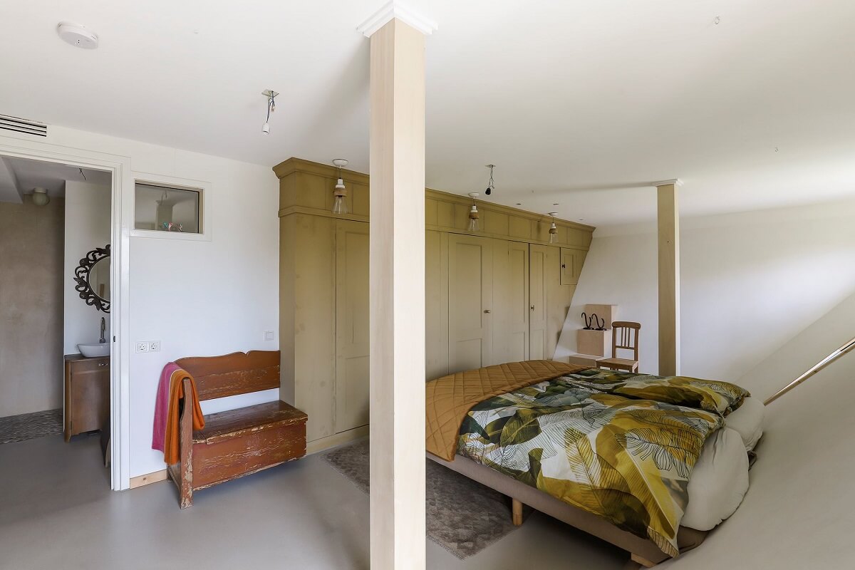 A Unique Upside Down House in The Netherlands 18 bedroom-slanted-wall-green-custom-vintage-wardrobes-nordroom