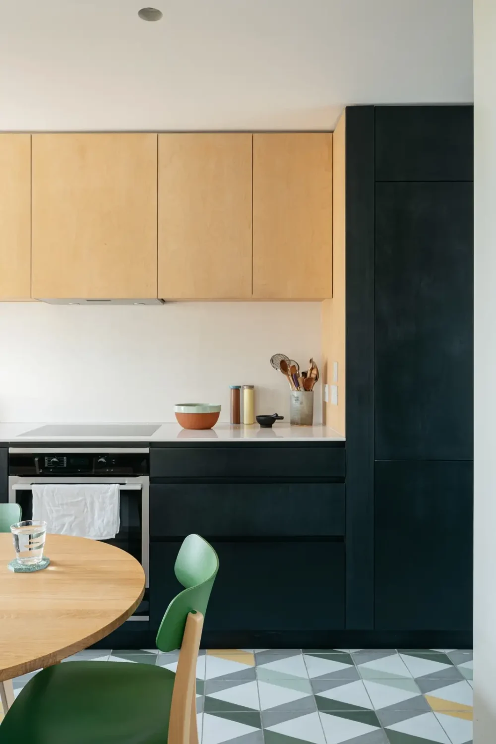 Modern Custom Interiors in a Victorian Home 3 black-natural-wood-kitchen-cabinets-geometric-floor-tiles-nordroom