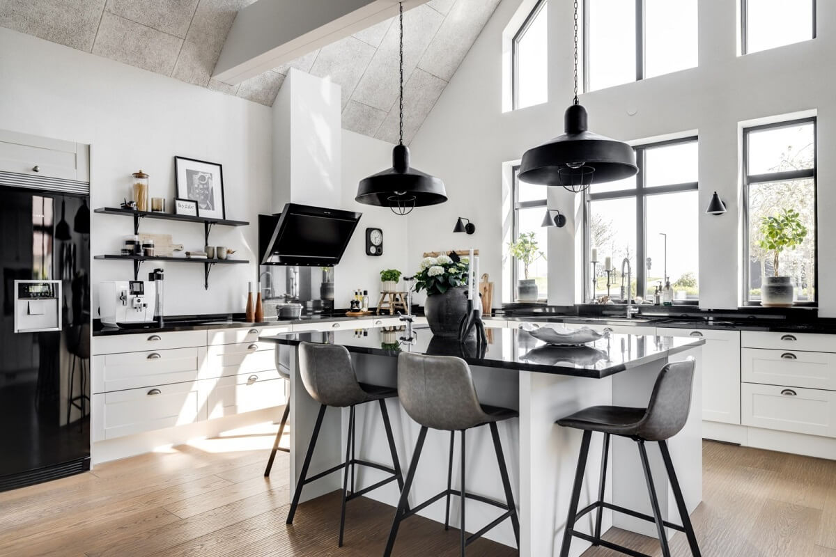 A Monochrome Swedish Villa with High Ceilings 14 black-white-kitchen-vaulted-ceiling-kitchen-island-nordroom