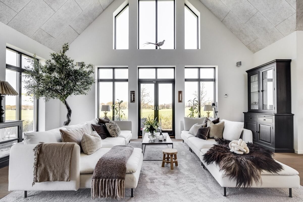 A Monochrome Swedish Villa with High Ceilings 3 black-white-living-room-high-ceilings-wooden-floor-large-rug-nordroom